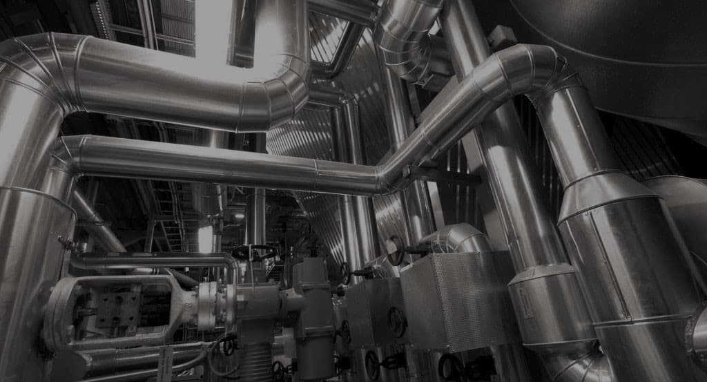 Insulated process piping in an industrial plant